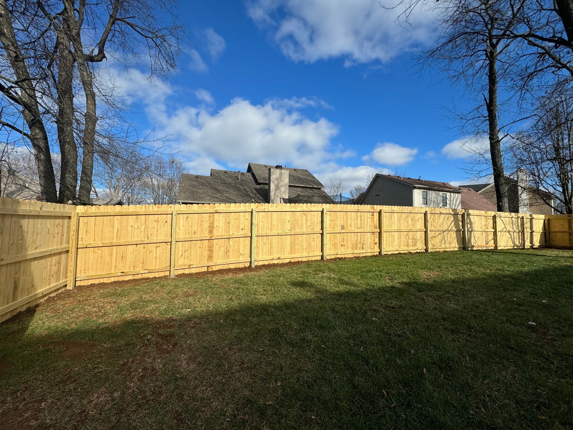 Classic wood privacy fence installed in Lexington KY backyard