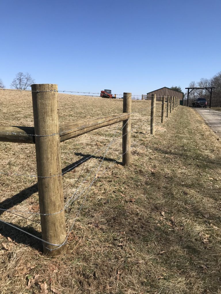 Barbed wire fence line on a Kentucky farmstead